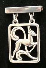 Danish silver pin of leaping