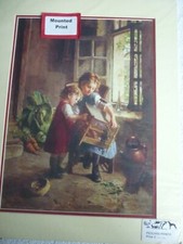 Girls with rabbit or guinea pig in cage,  print mounted for framing