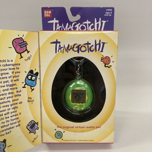 Tamagotchi green yellow - tamagotchi,