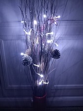 Twigs With Fir Cones And Lights
