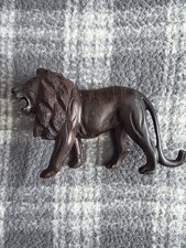 Hand carved lion roaring from