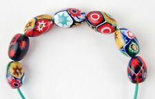 Venetian E. Moretti millefiori beads. Seven small oval beads