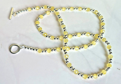 Yellow coloured faceted - yellow,