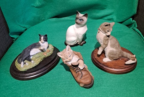 Three cat figurines from - cat,