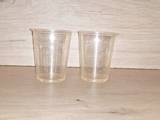 2 Johnson’s Of Hendon plastic measuring beakers cups.