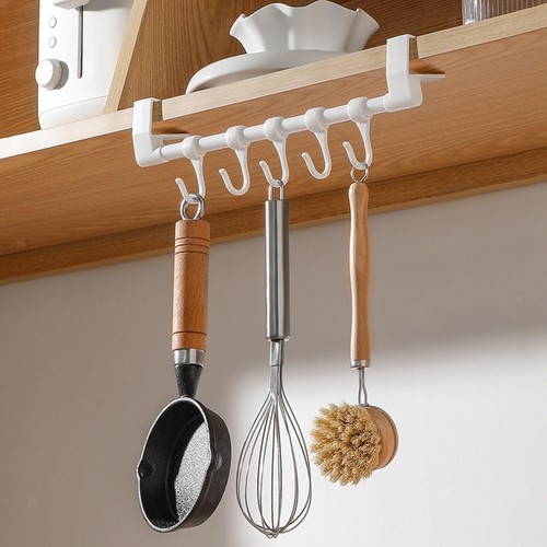Over the cupboard door towel - the,