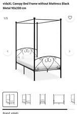 Gorgeous single four poster bed with sheer curtains