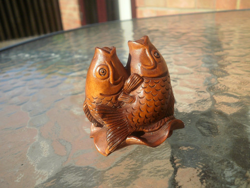 Hand carved wood - hand, fish