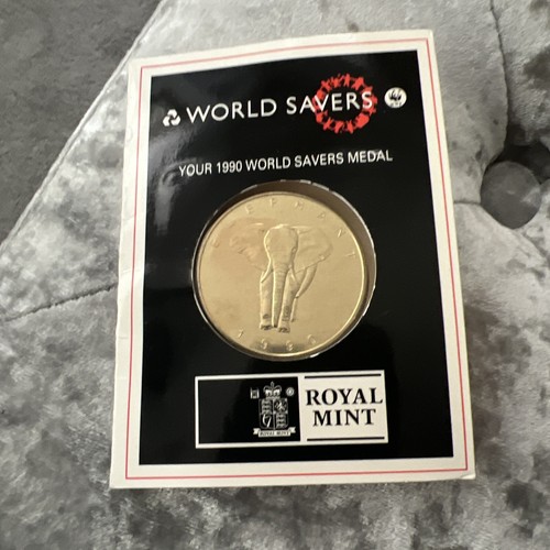 World savers coin 1990 - world,