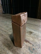 unusual sculpture copper cigarette box with lead cigarettes. artist unknown