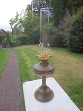 A VINTAGE BRASS OIL LAMP COMPLETE WITH CHIMNEY SHEPARDS HUT LAMP