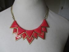 Chunky statement necklace, pink triangle/'V' shaped pieces on gold colour chain