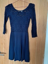 Gorgeous lace detail party dress in navy blue. Size 8 by H and M