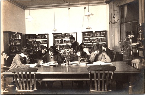 Schoolgirls reading library - in,