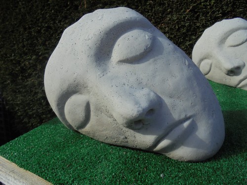 Resting face concrete garden