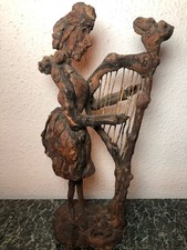 A UNIQUE IRISH CARVED FRUITWOOD & BURL ROOT FOLK ART FIGURE OF A LADY HARPIST