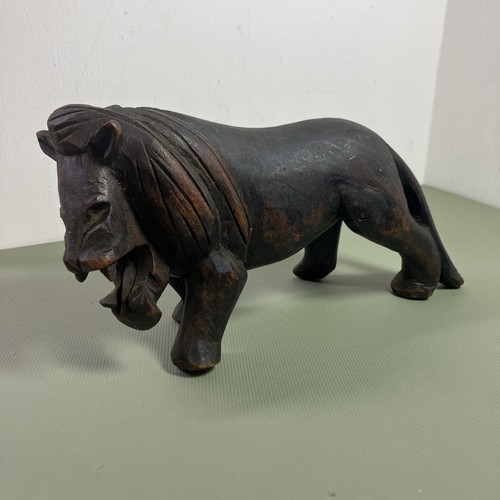 Carved dark wood lion - carved,