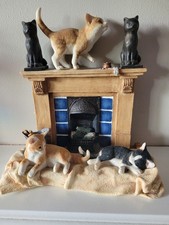 Sharratt and Simpson Cats, kittens on fireplace.