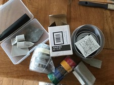 Random diy materials- electrical and sealant tape, pop-up basin plug grout tool