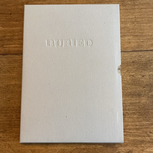 Signed first edition - buried, by