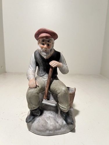 Old man sitting down holding - old,