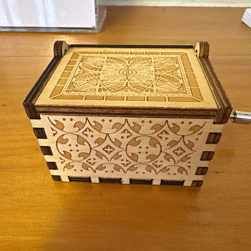 Wooden hand crank music box - hand,