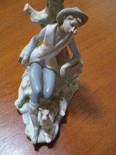 LLADRO, 1970s. Porcelain figure, Boy with his dog. Table lamp. 12 inches tall.
