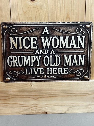 Humorous metal sign - man, cave