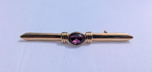 Gold brooch with - with, dark
