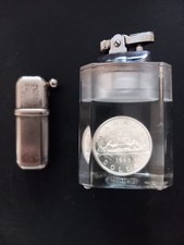 Table Lighter Containing 1963 Canadian Dollar And Sarome Pocket Lighter