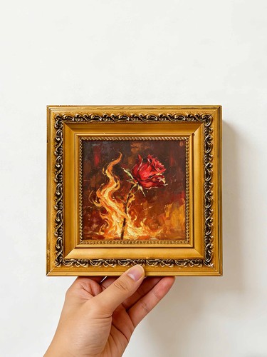 Rose burning golden flames - in,