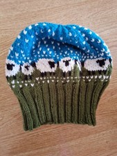 knitted warm hat with sheep