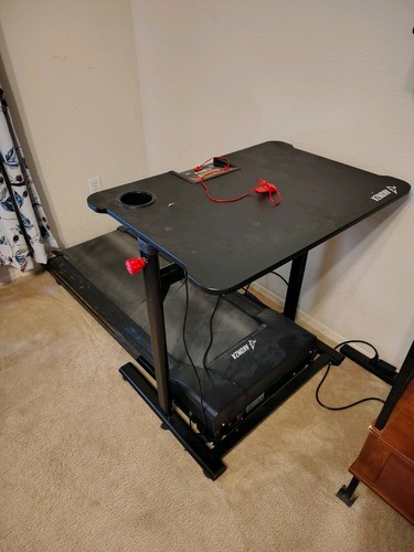 Treadmill with integrated work