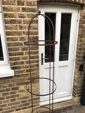 Large garden metal round obelisk in rust finish