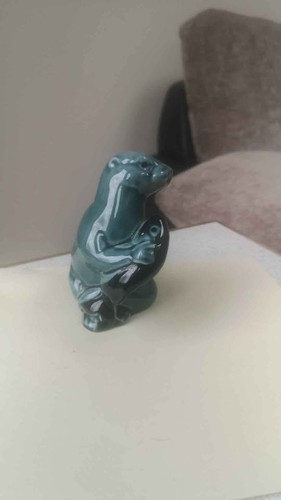 Poole pottery otter with - , fish