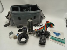 Canon A-1 35mm SLR Film Camera Bundle with 2 Lenses and Accessories untested