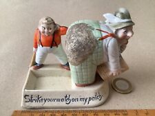 SCHAFER & VATER COMICAL POTTERY MATCH STRIKER,- ‘ Strikeyourmatchonmypatch’.