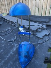 translucent blue telescopic halogen lamp, associated with the Y2K aesthetic