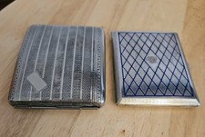 Two vintage white metal cigarette cases, one with inlaid enamel
