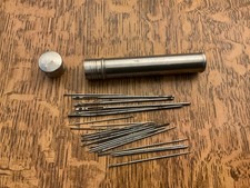 VINTAGE NEEDLE CASE,NICKEL SILVER WITH SCREW TOP, WITH NEEDLES ALL SIZES VGC