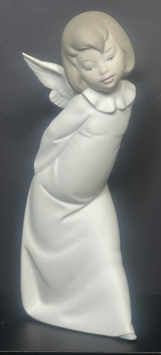 Lladro curious angel - "curious, angel"