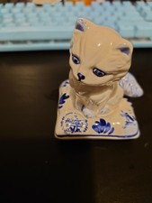 Delft Blue Holland Cat Sitting On Pillow