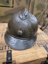 WW1 genuine French Helmet with liner and hand written description on the side.
