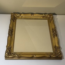 Gold ornate wall mirror with - ornate,