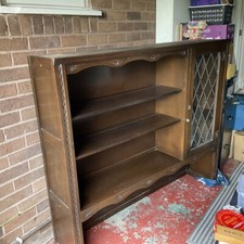 Jaycee. Top of a Dresser. The wood is dark oak veneer.