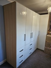 Triple Wardrobe And Corner Unit Set. High Gloss White Doors And Wood Carcase.