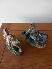 2 American Indian Figures On