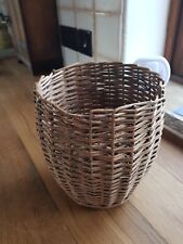 A vintage wicker waste paper basket, charming