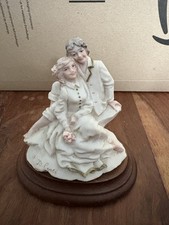 Priest Marians Giftware A Belcari seated woman and man figurine 10 cm tall