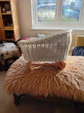 A White Wicker Dolls Rocking Crib Comes With Blankets and Mattress 